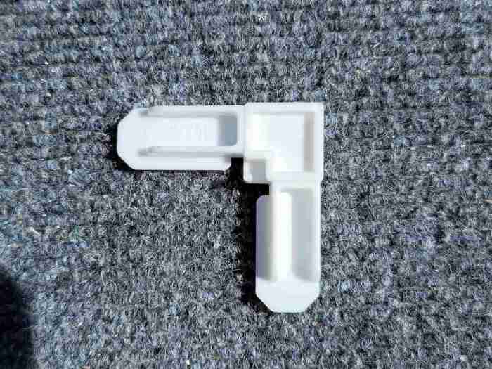 White plastic corner for window screen frame 5/16