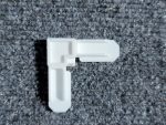 Top view of 5/16 white plastic window screen corner