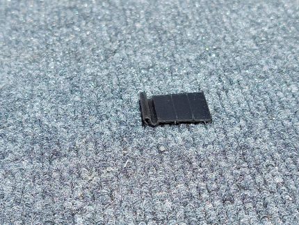 Looking at side view of black pull tab